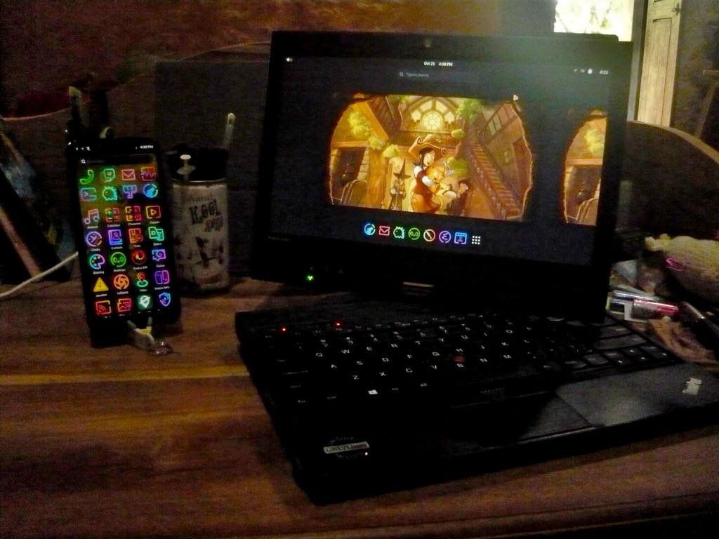 My laptop and phone, both sporting the same icon theme